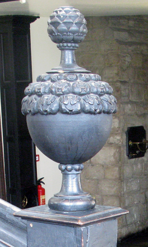 Detail of the Black Staircase of Durham Castle. The pineapple has lost its leaves, but its importance as the centrepiece of a bowl of fruit is easy to see.